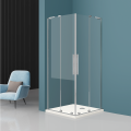 Kabina prysznicowa DAKOTA DUO Veldman z profilami w kolorze chrom, w rogu minimalistycznej łazienki, obok fotel z poduszką.png
