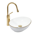 Biała owalna umywalka nablatowa ze złotą krawędzią VERA Veldman ze złotą baterią