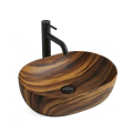 Owalna umywalka nablatowa ANNA WOOD w kolorze imitacji drewna Veldman z czarną baterią