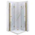 Kabina prysznicowa COMO DUO Veldman z przezroczystego szkła hartowanego, z dwoma otwartymi, złożonymi drzwiami w kolorze złotym, osadzona na białym brodziku.png